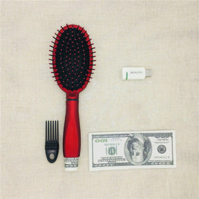 Hairbrush with concealed storage compartment